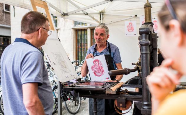 Onze drukker aan het werk